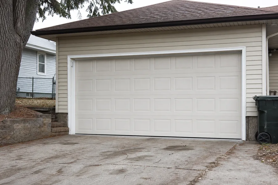 A new sectional garage door installed by OnPoint Pro Doors Kansas City in Kansas City, MO